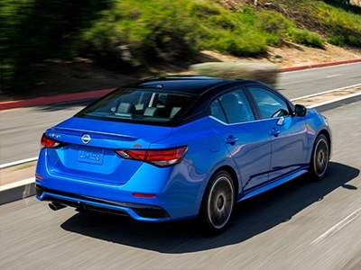 Blue Sentra on road