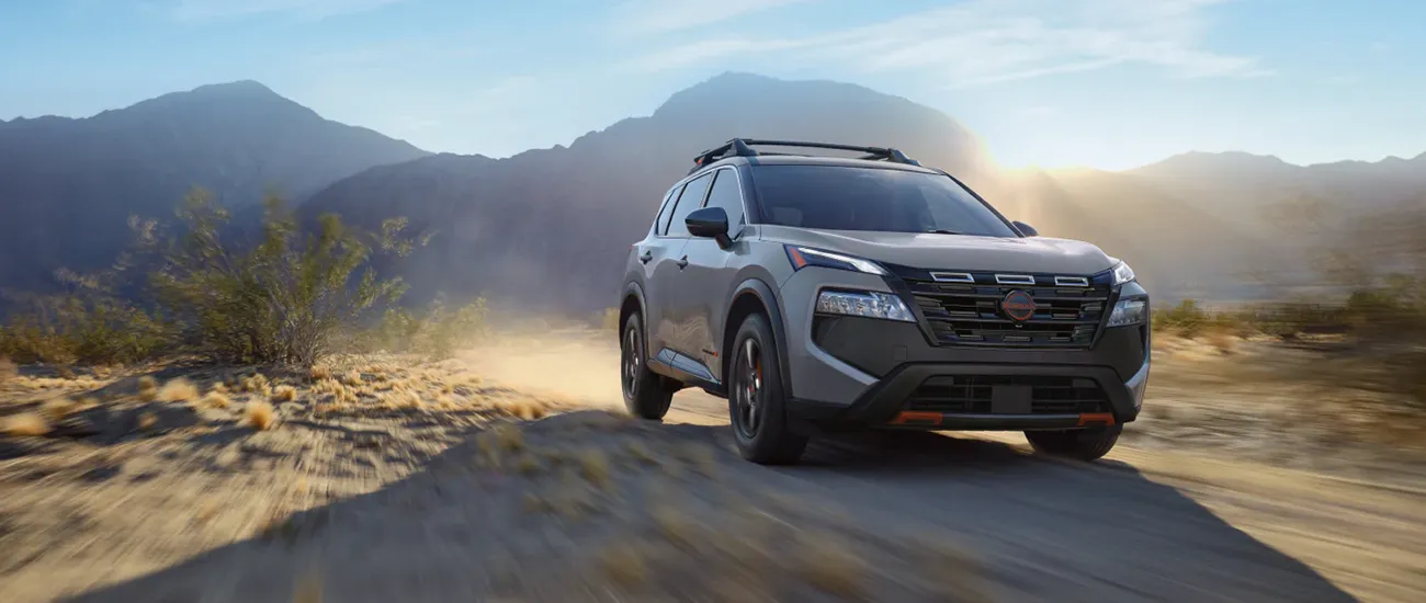 Nissan SUV driving on a desert trail