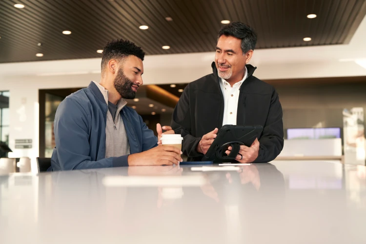 Nissan dealership representative discussing vehicle options with a customer