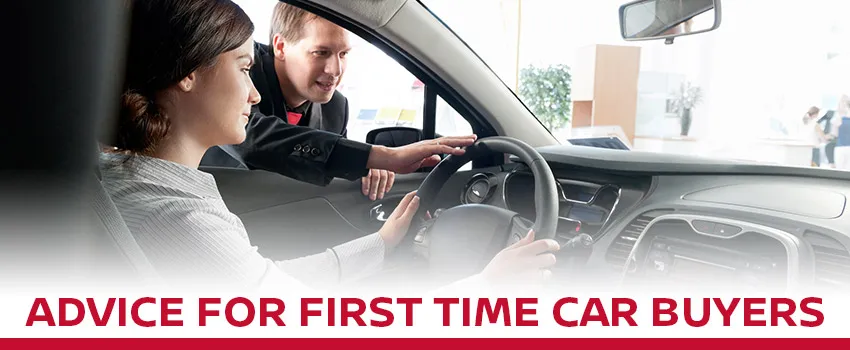 Nissan sales advisor helping a first-time car buyer