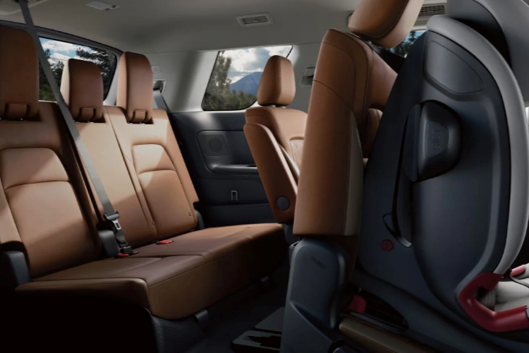 Open trunk of red Nissan Altima showing cargo space
