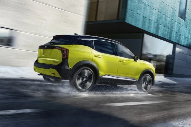 Lime green Nissan Kicks cornering on a wet city street