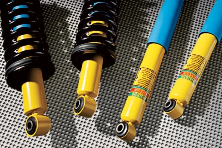 Close-up of yellow and blue Bilstein off-road shock absorbers