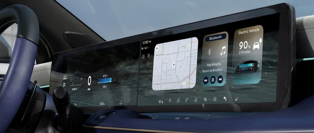Nissan LEAF dashboard showing the wide dual-screen display with navigation and media