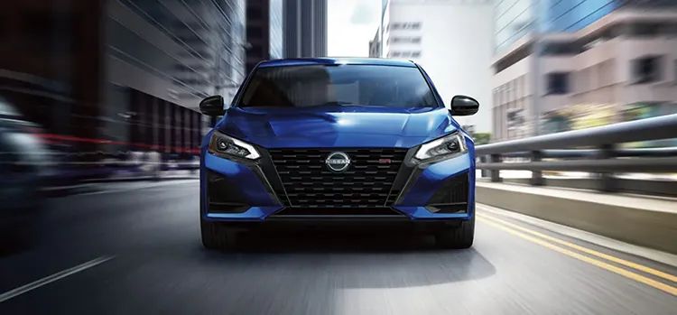 Blue Altima driving