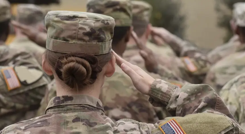 US military service members saluting