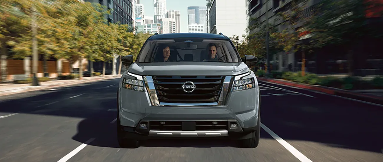 Nissan SUV driving on a city road