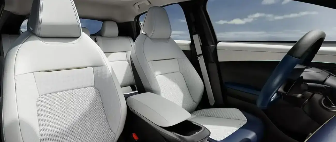 Cutaway view of the Nissan LEAF cabin showing the light-coloured front and rear seats
