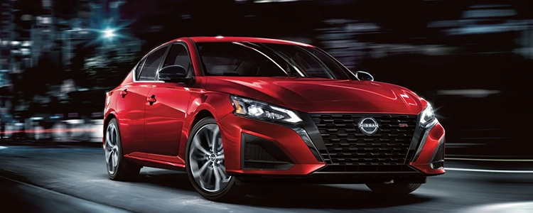 Red 2025 Nissan Altima Driving at Night