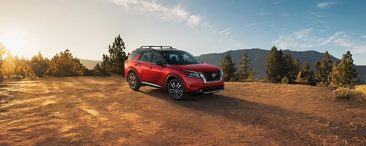 Red 2025 Nissan Pathfinder® Parked in the Mountains