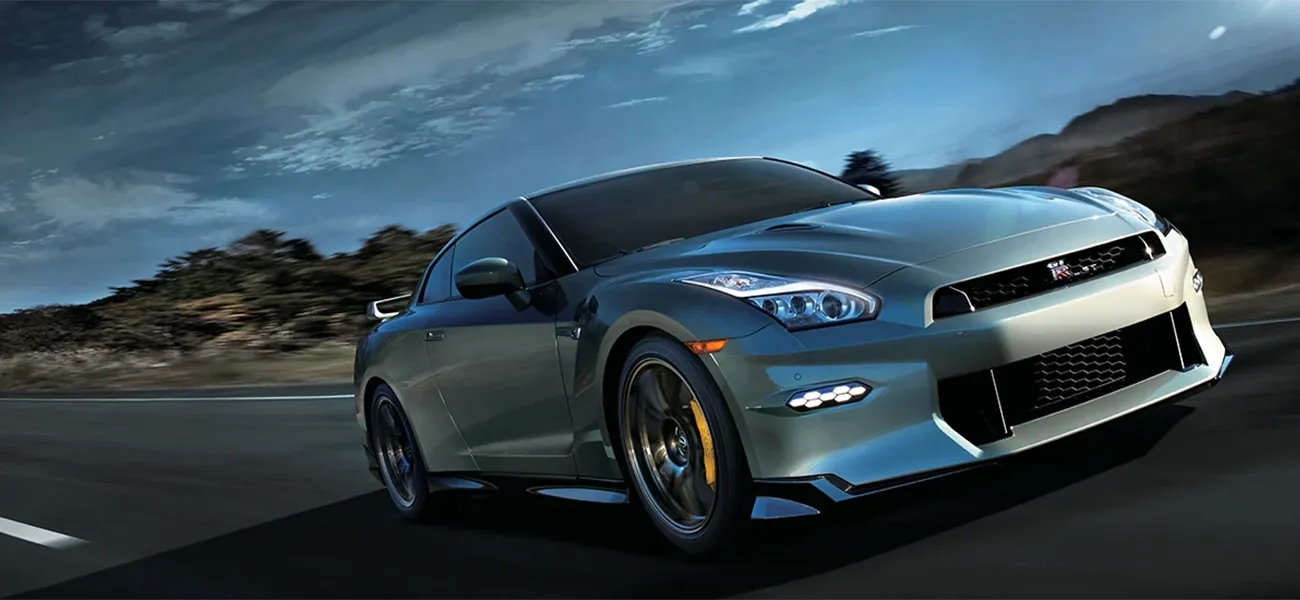 Red GT-R driving on racetrack