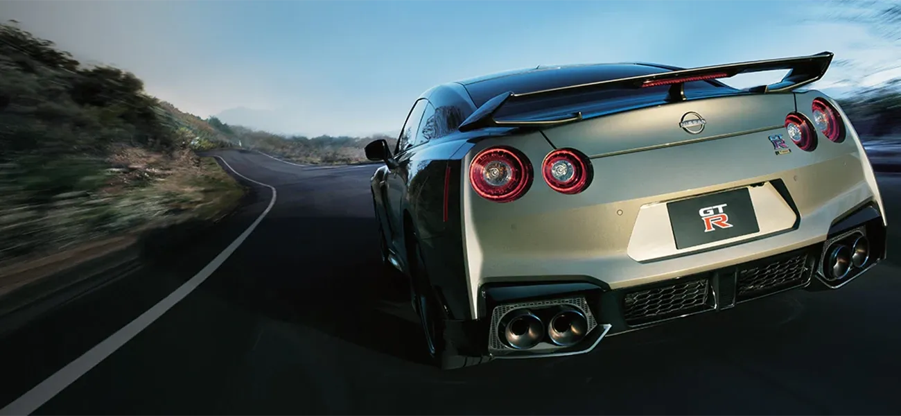 Black GT-R driving through tunnel